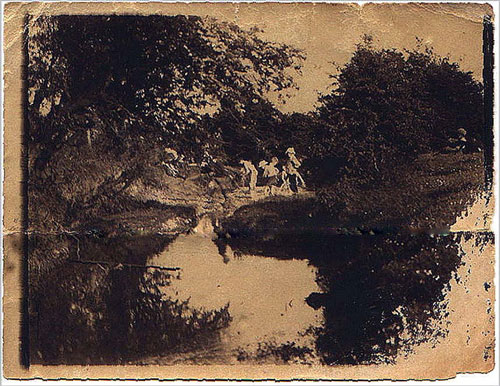 Sepia photo of children at brook